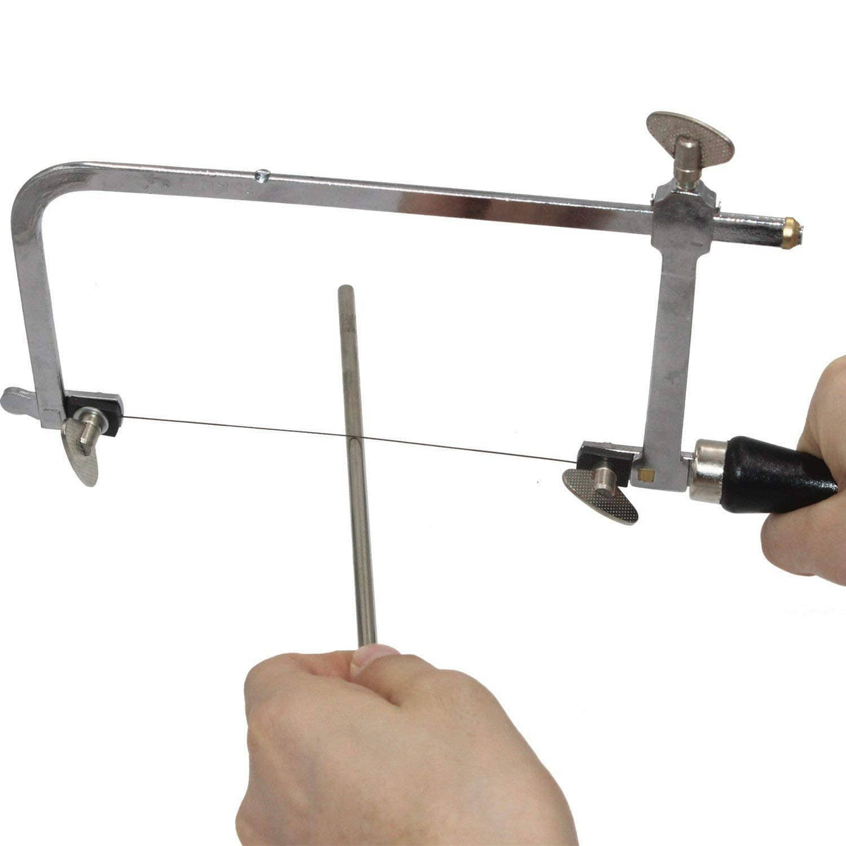 Jeweler's saw frame held in hand with blade tensioned and black grip handle