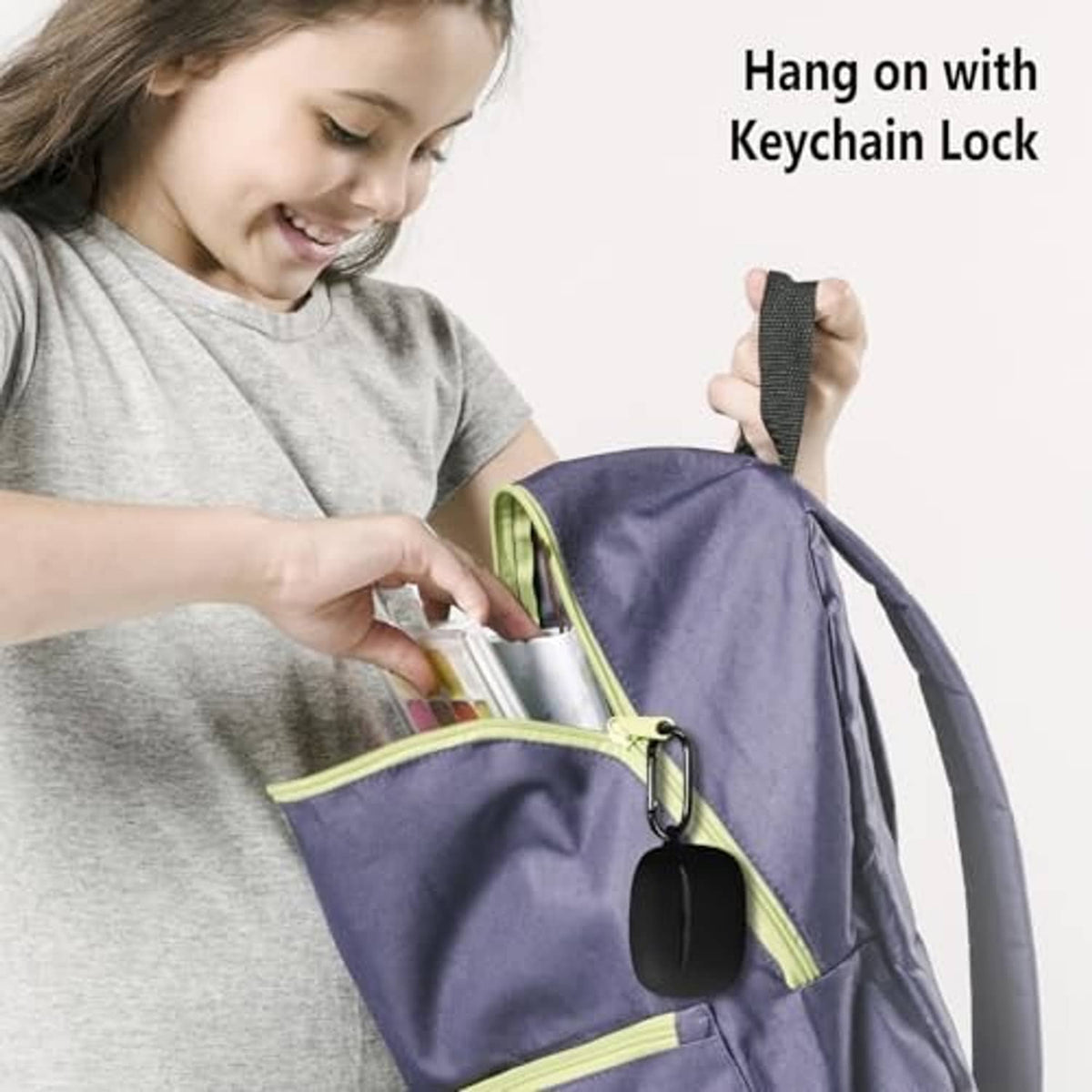 Black silicone earbuds case with keychain strap, hanging from a backpack zipper.