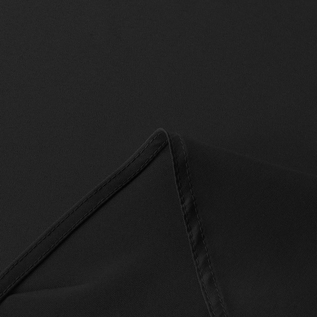 Black tablecloth edge with stitched hem and reinforced seam