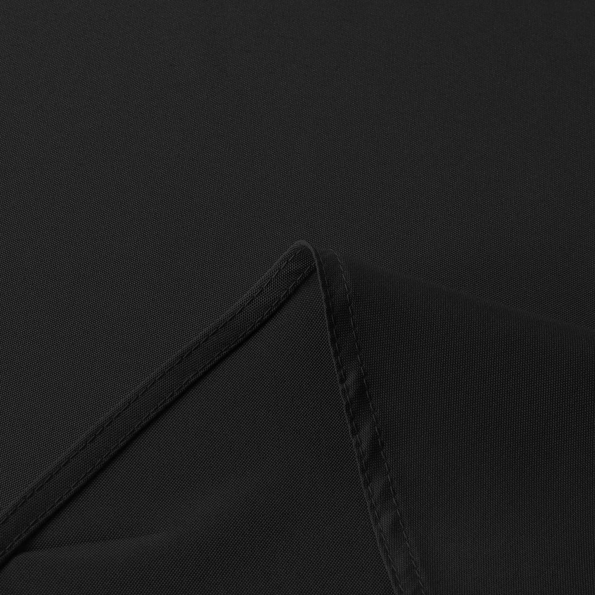 Black tablecloth edge with stitched hem and reinforced seam