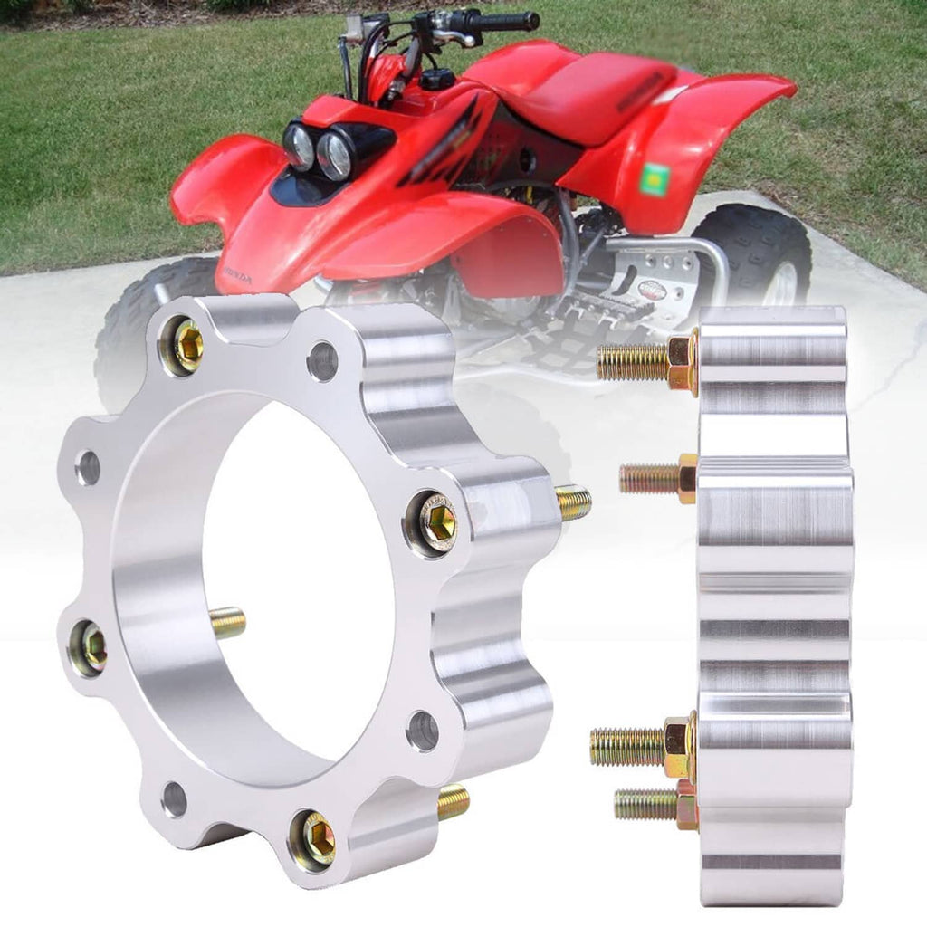 Front wheel spacer with threaded studs, mounted beside an ATV front wheel