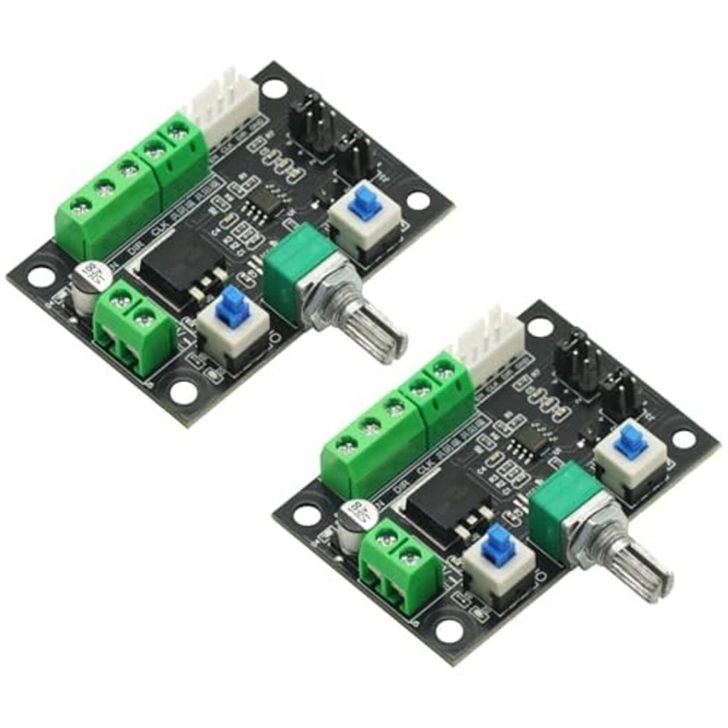 Two stepper motor controller boards with green screw terminals, blue switches, and metal shafts