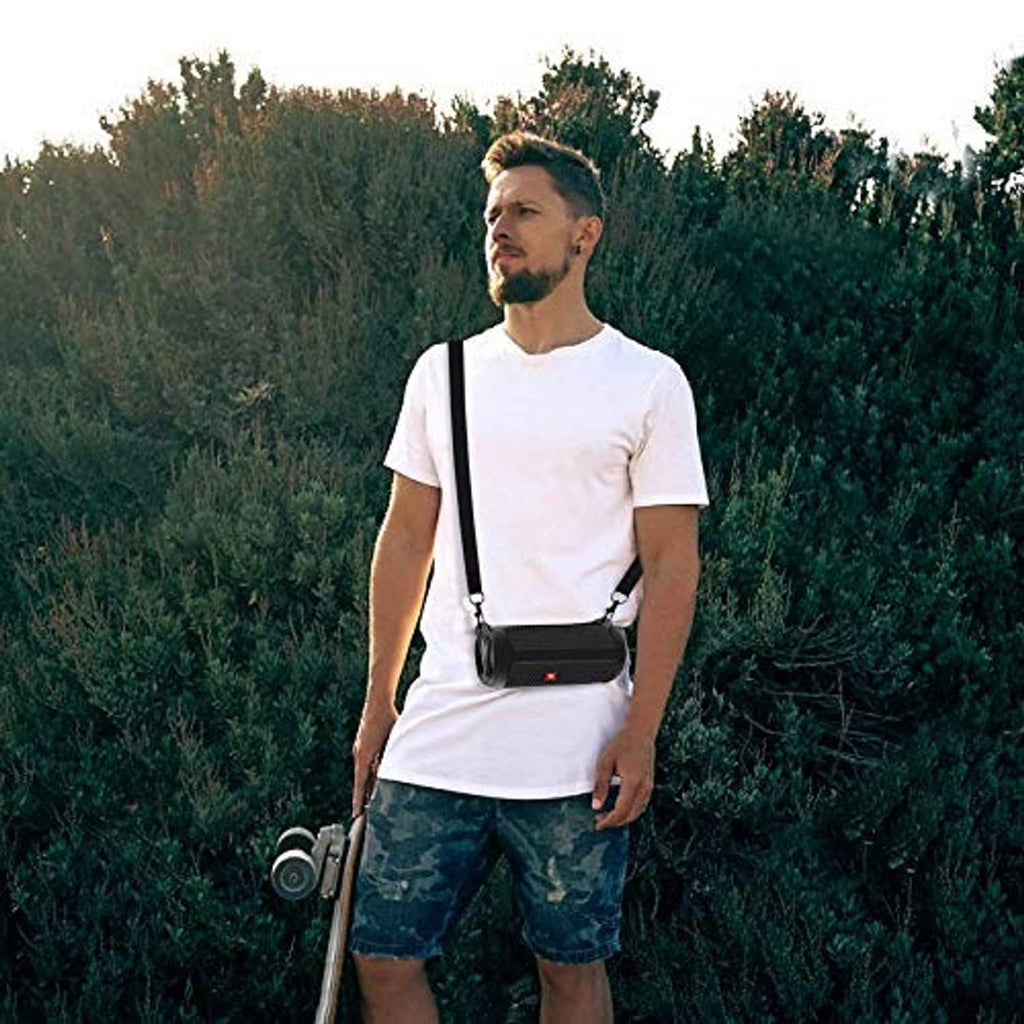 Black silicone speaker case worn crossbody with adjustable strap and carabiner clip