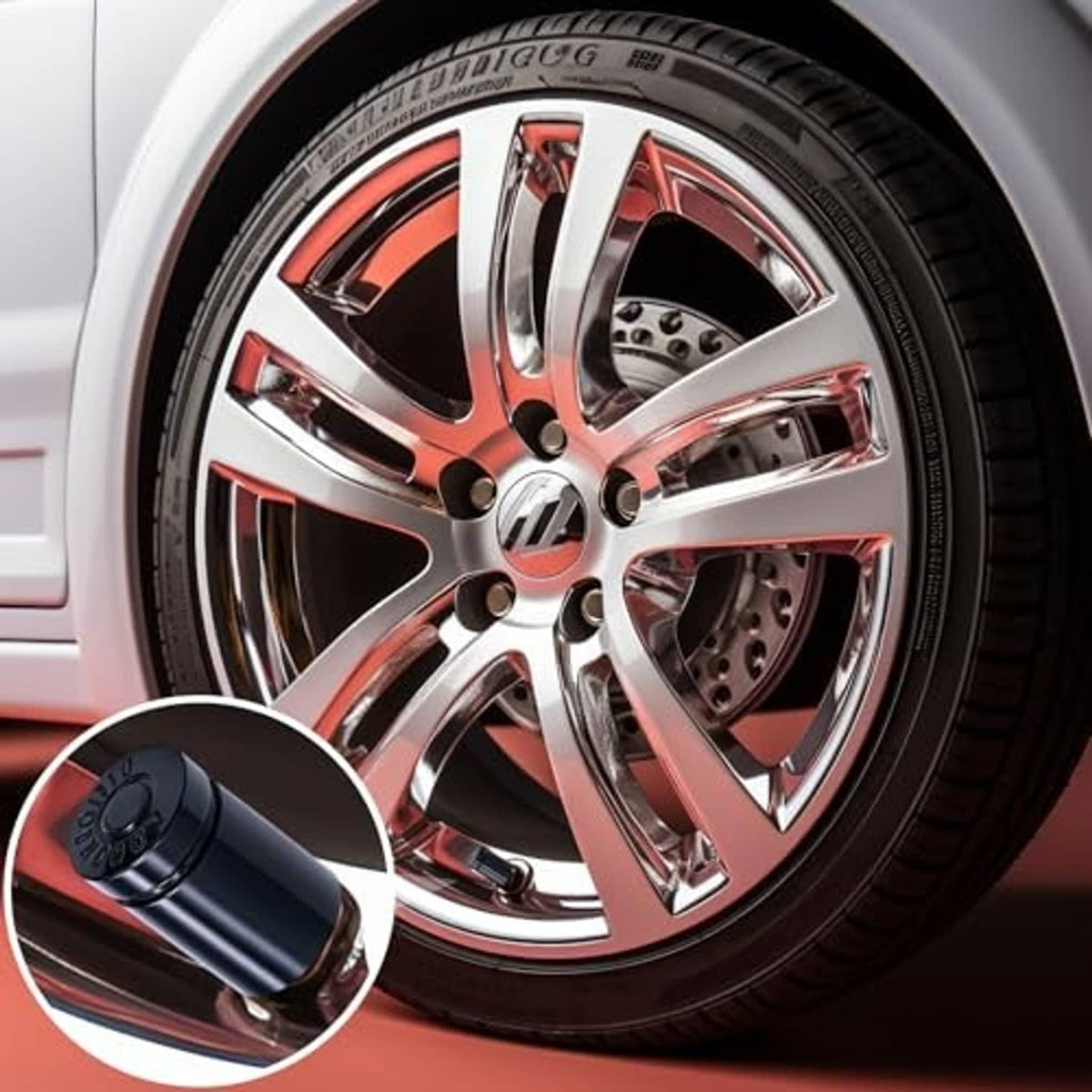 Black bullet valve stem cap on a chrome wheel rim