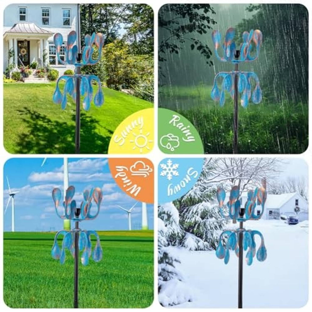 Blue metal wind spinner with curled petal blades on black stake outdoors in rain/snow