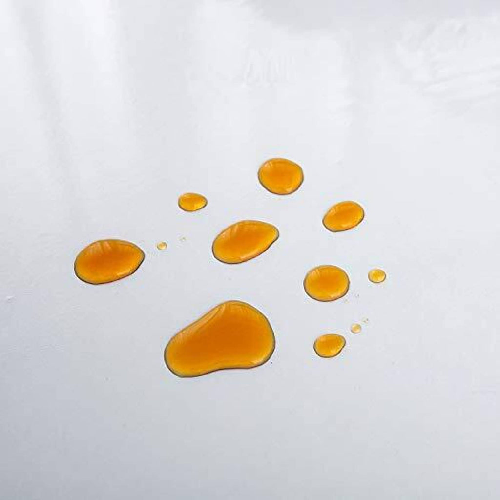 Water-repellent clear plastic oval table cover with visible droplets