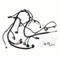 Engine wiring harness with black wire loom and multiple electrical connectors