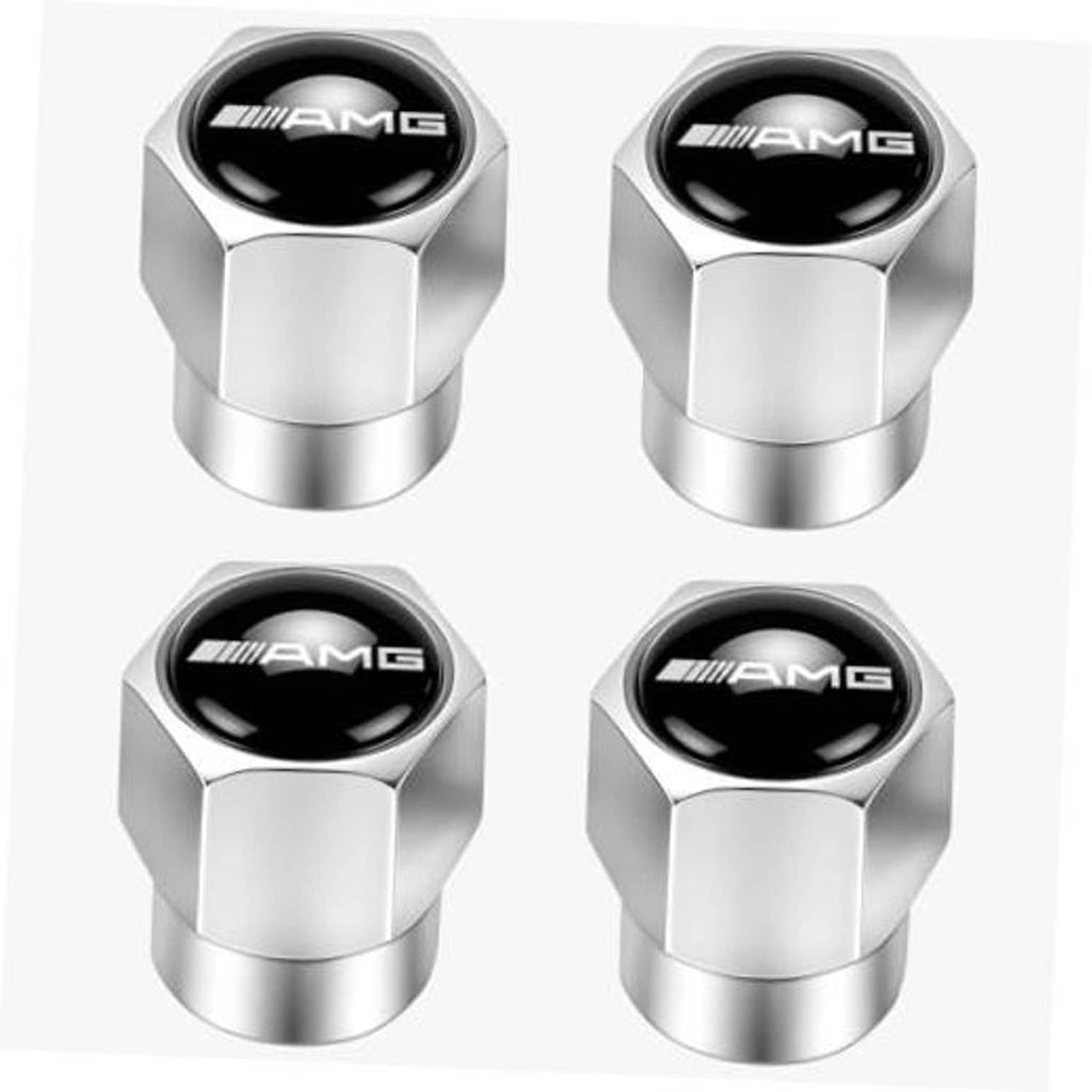 Four silver metal tire valve stem caps with black AMG emblem