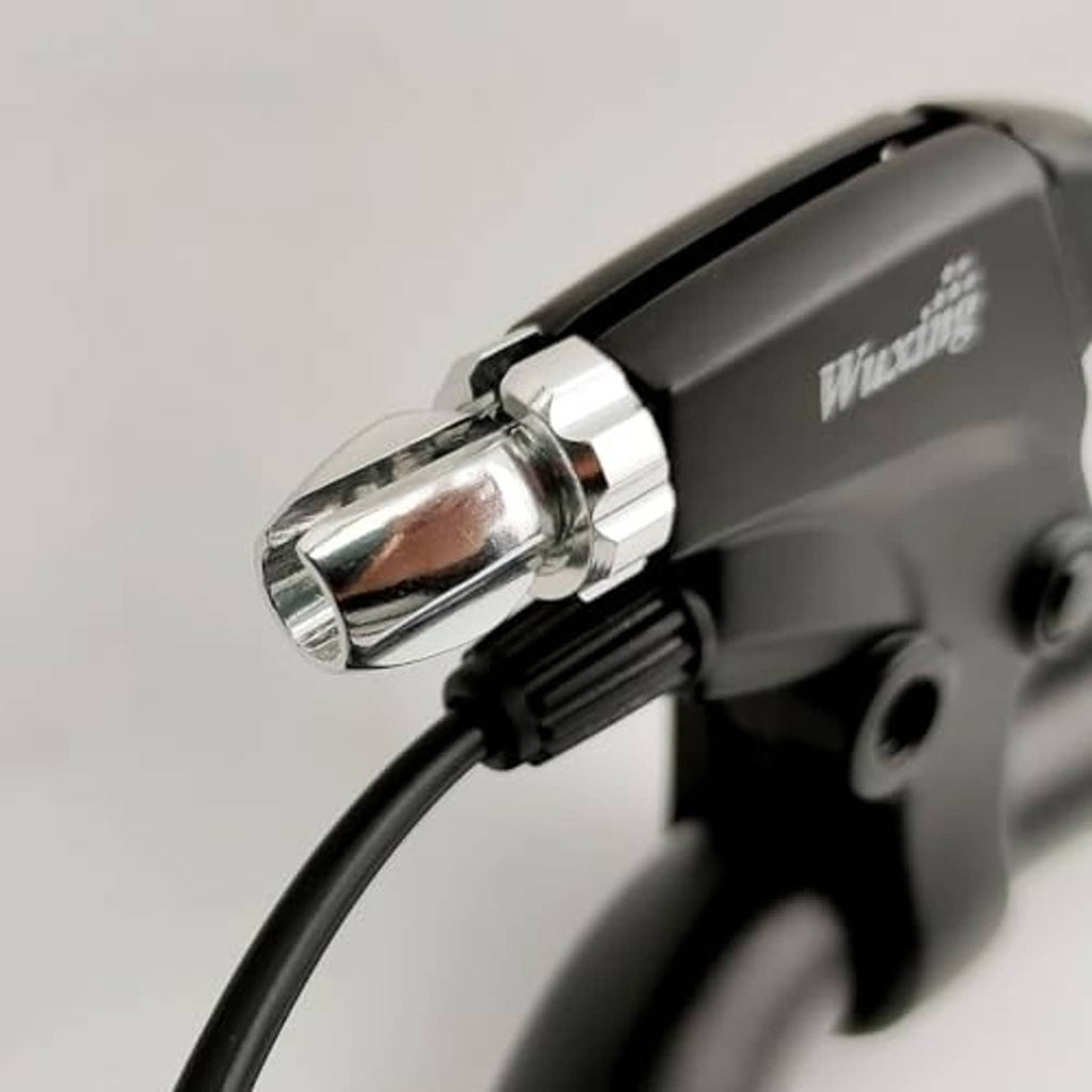 Close-up of black brake lever grip end with metal mounting and cable