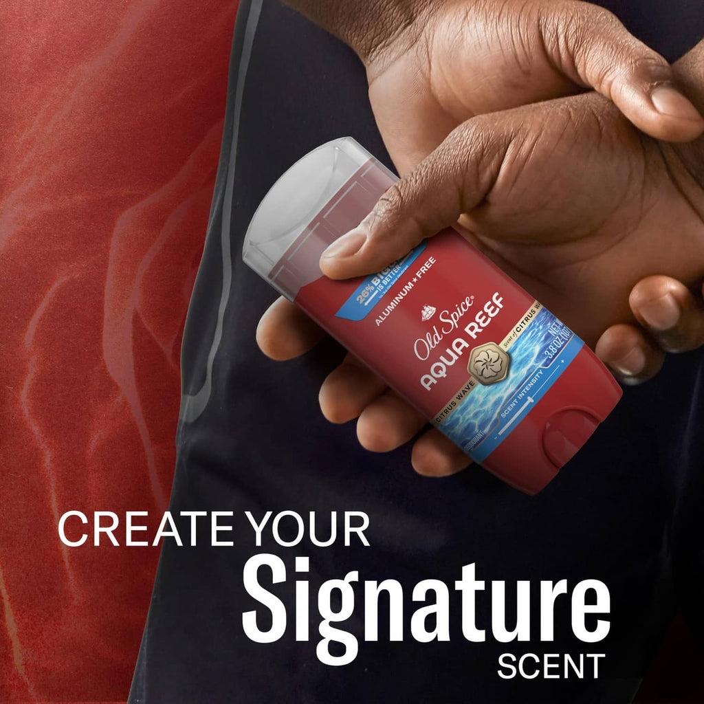 Old Spice Aqua Reef deodorant stick in hand, red container with clear cap.