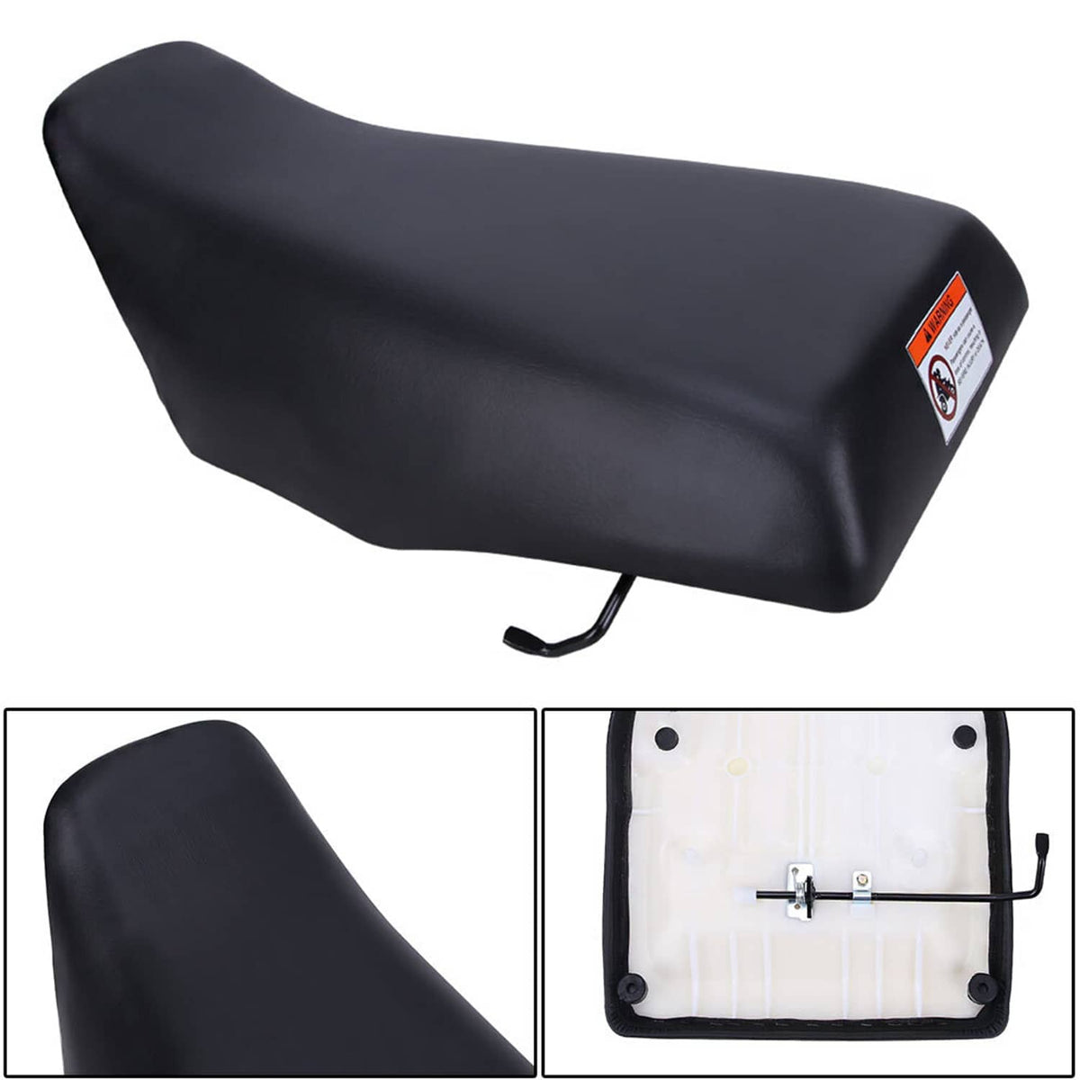 Black ATV seat cover with warning label and visible underside mounting bracket