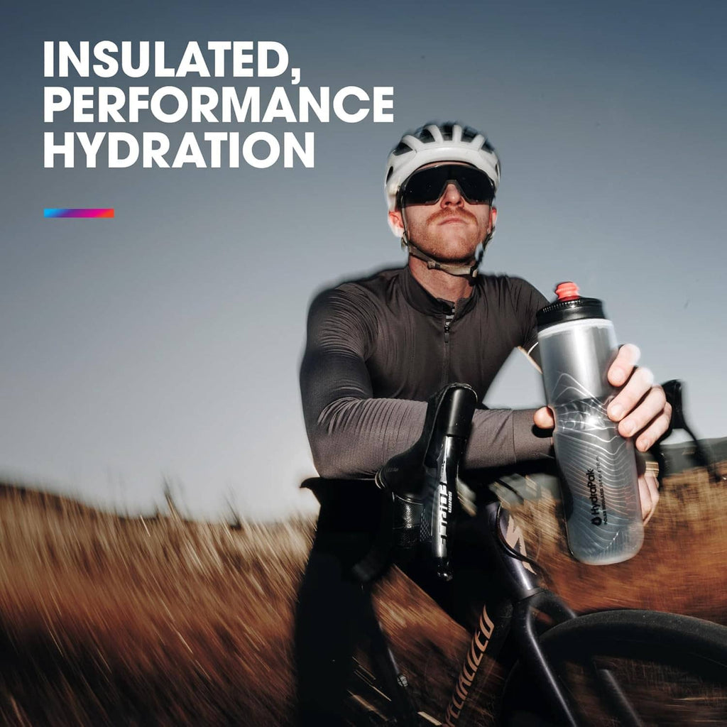 Stainless insulated bike water bottle with black cap, held while cycling