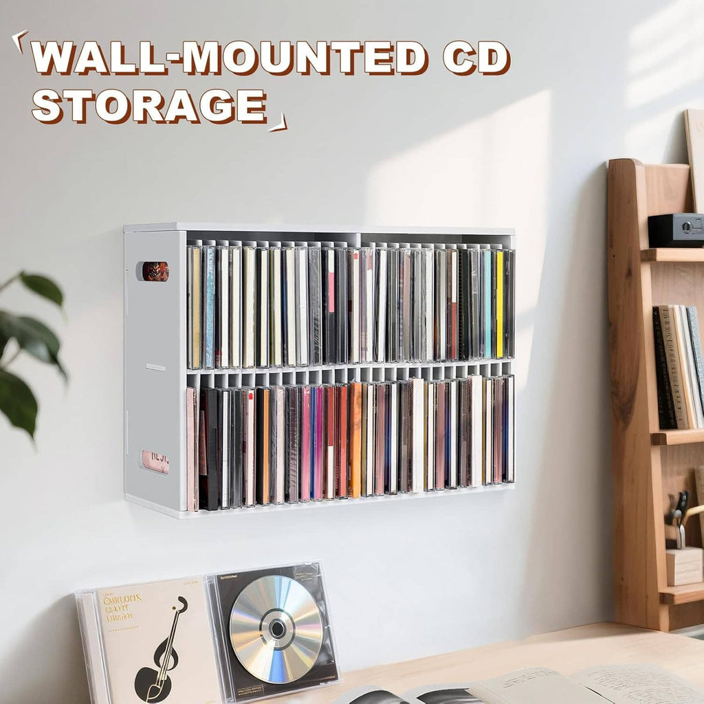 Wall-mounted white CD organizer with two rows of CD jewel cases on a wall
