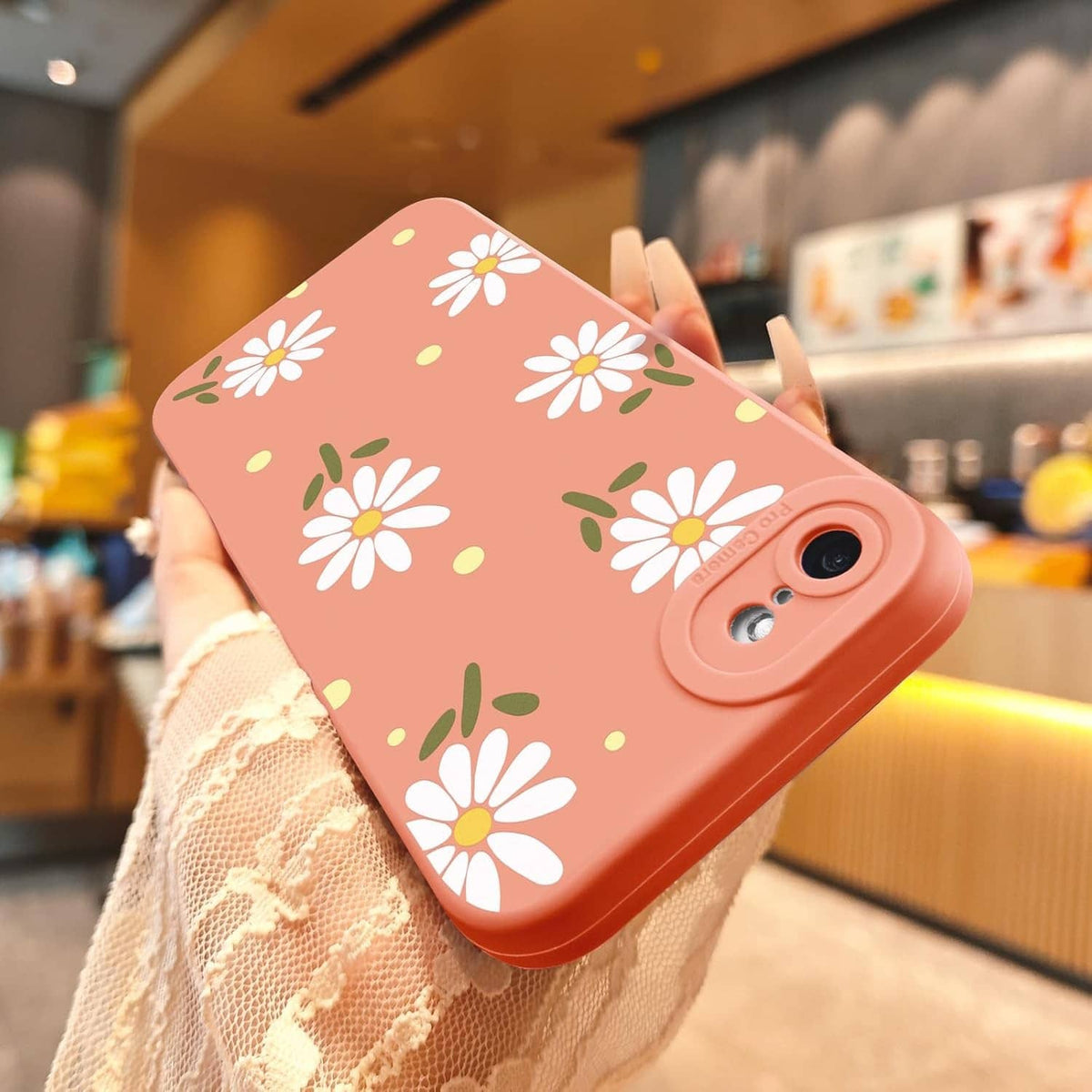 Pink iPhone SE/8/7 phone case with large daisy and yellow dot pattern