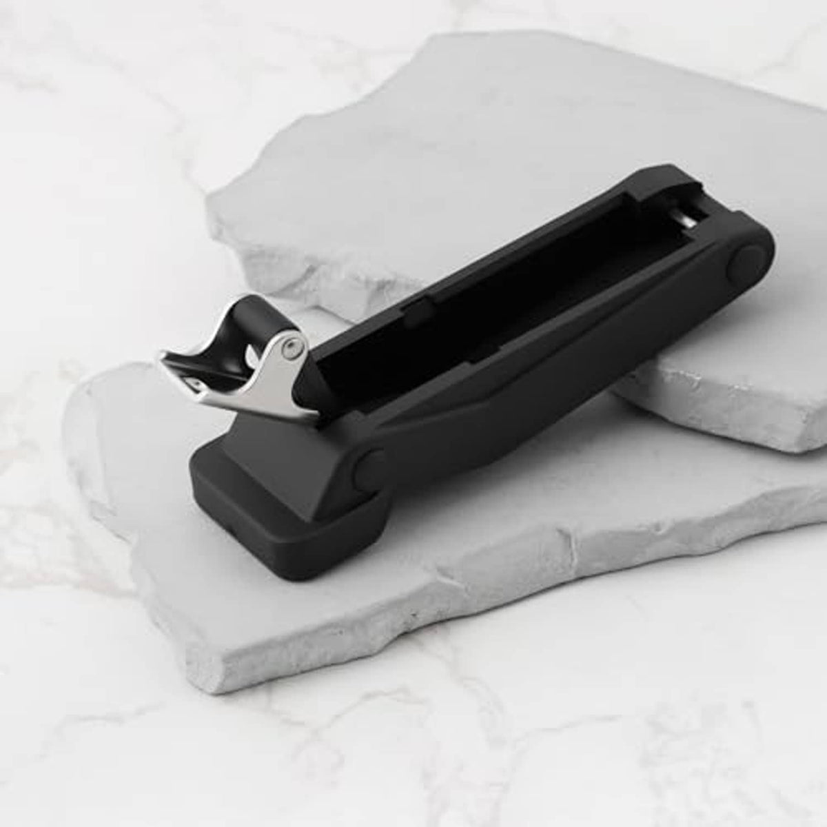 Black rubber latch holder with silver locking clip and mounting bracket