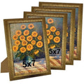 Set of four ornate gold 5x7 photo frames with textured vintage border