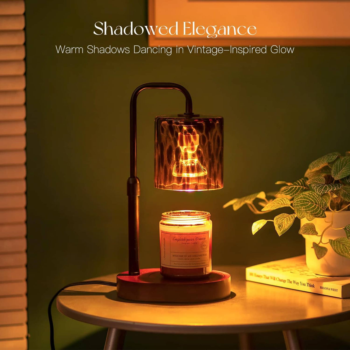 Candle warmer lamp with amber tortoise-shell glass shade, lit candle, and tall handle