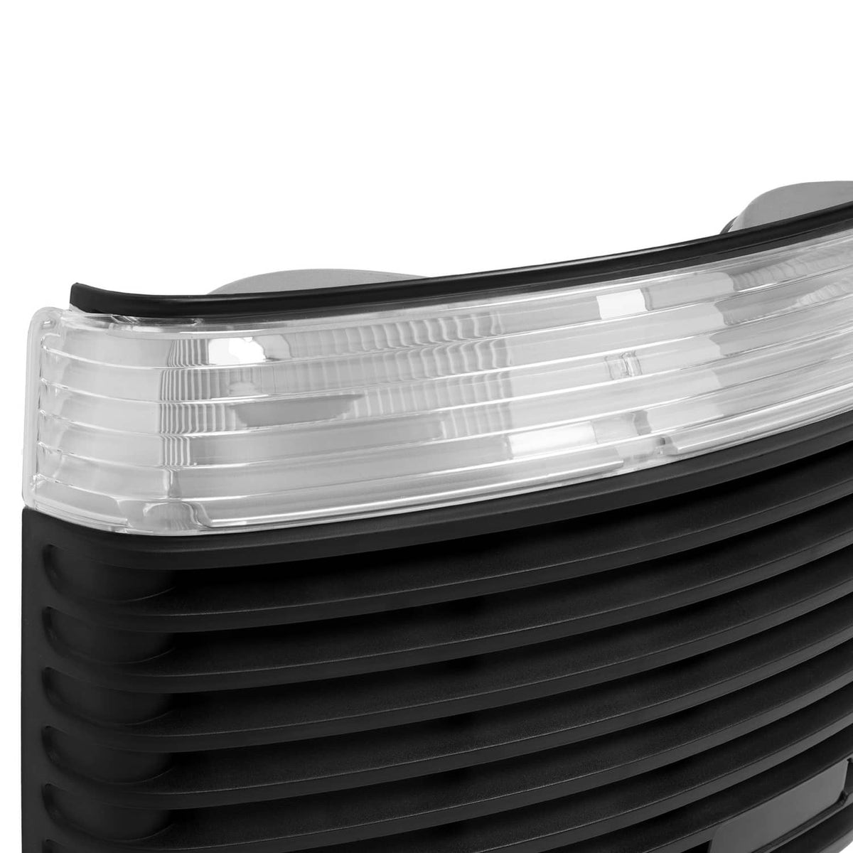 Clear headlight lens and black hood grille with layered horizontal slats