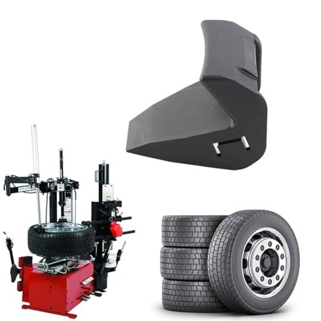 Dark gray tire machine jaw protector with angled contact pad beside tire wheel