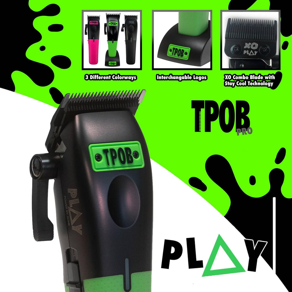 Men's hair clipper with black body and green lower grip, front view close-up