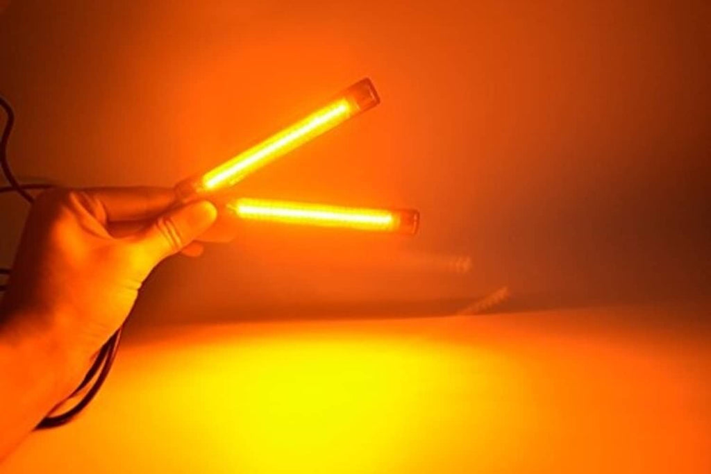 Amber-lit LED turn signal strips glowing with a warm yellow-orange light