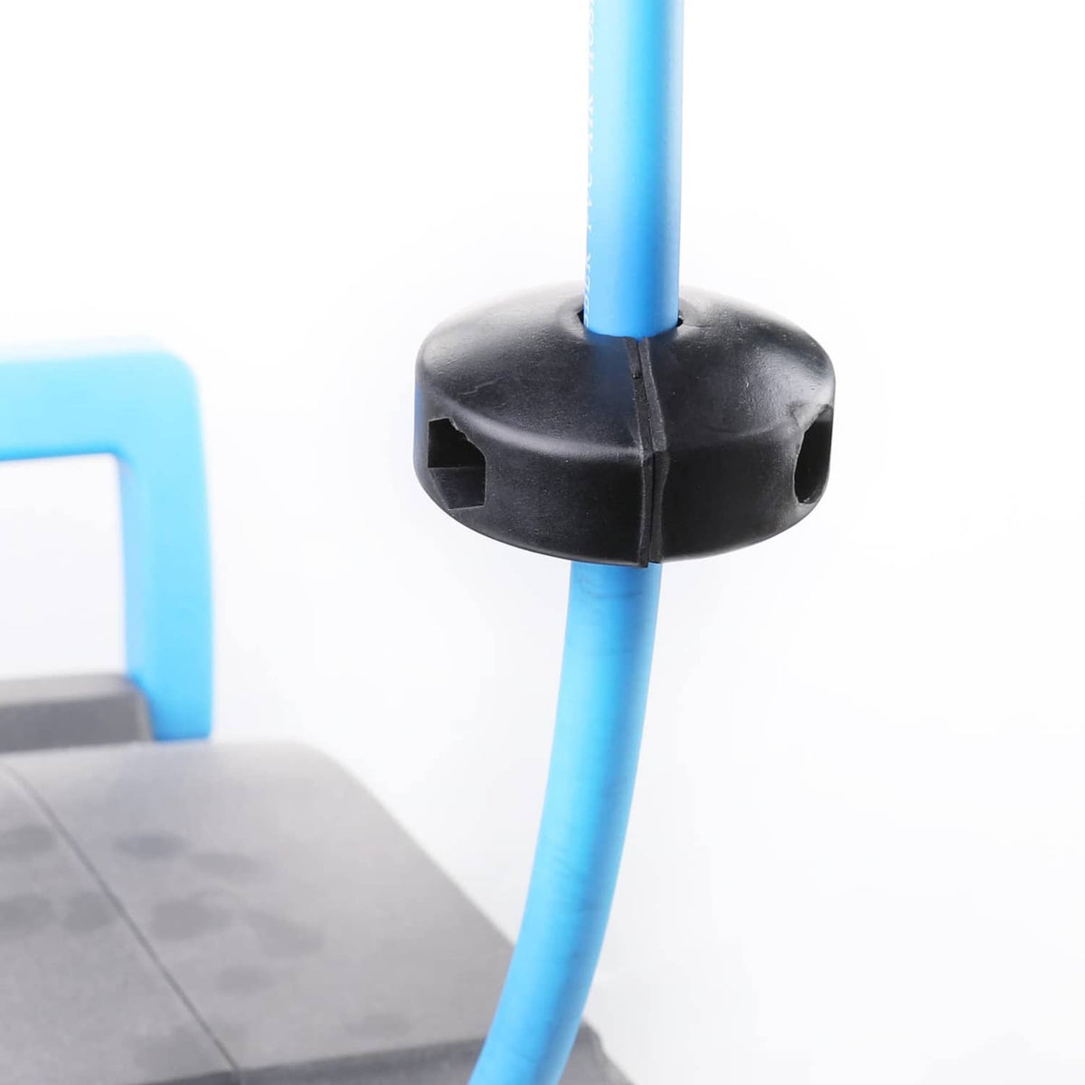 Black ball stopper base with blue hose inserted