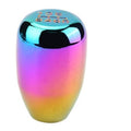 Rainbow metallic manual gear shift knob with gear icons on top and glossy black center