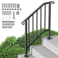 Black outdoor stair railing with arched top posts and vertical bars