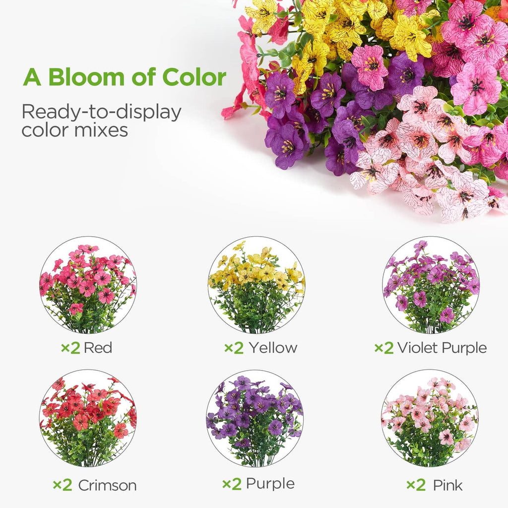Mixed-color artificial flower blossoms in purple, pink, and yellow on green stems