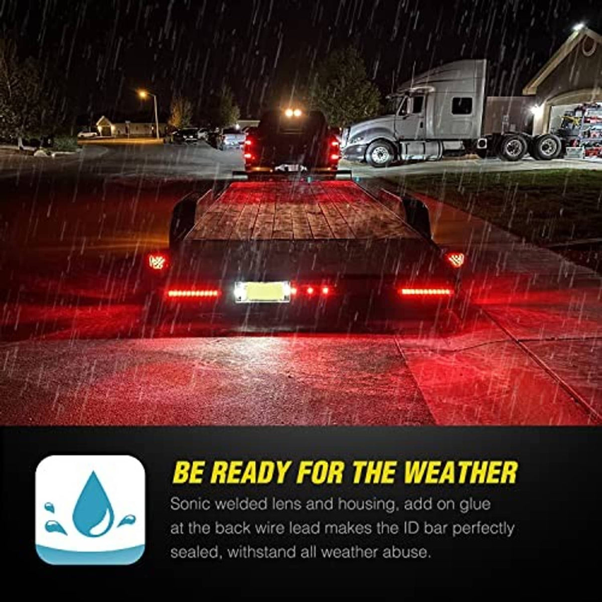 Rear trailer stop lights with red LED light bars glowing on a vehicle in wet weather