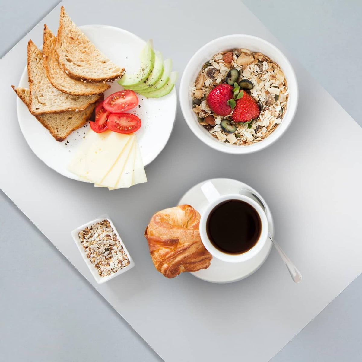 Clear matte plastic placemat under plates and cups, square with rounded corners