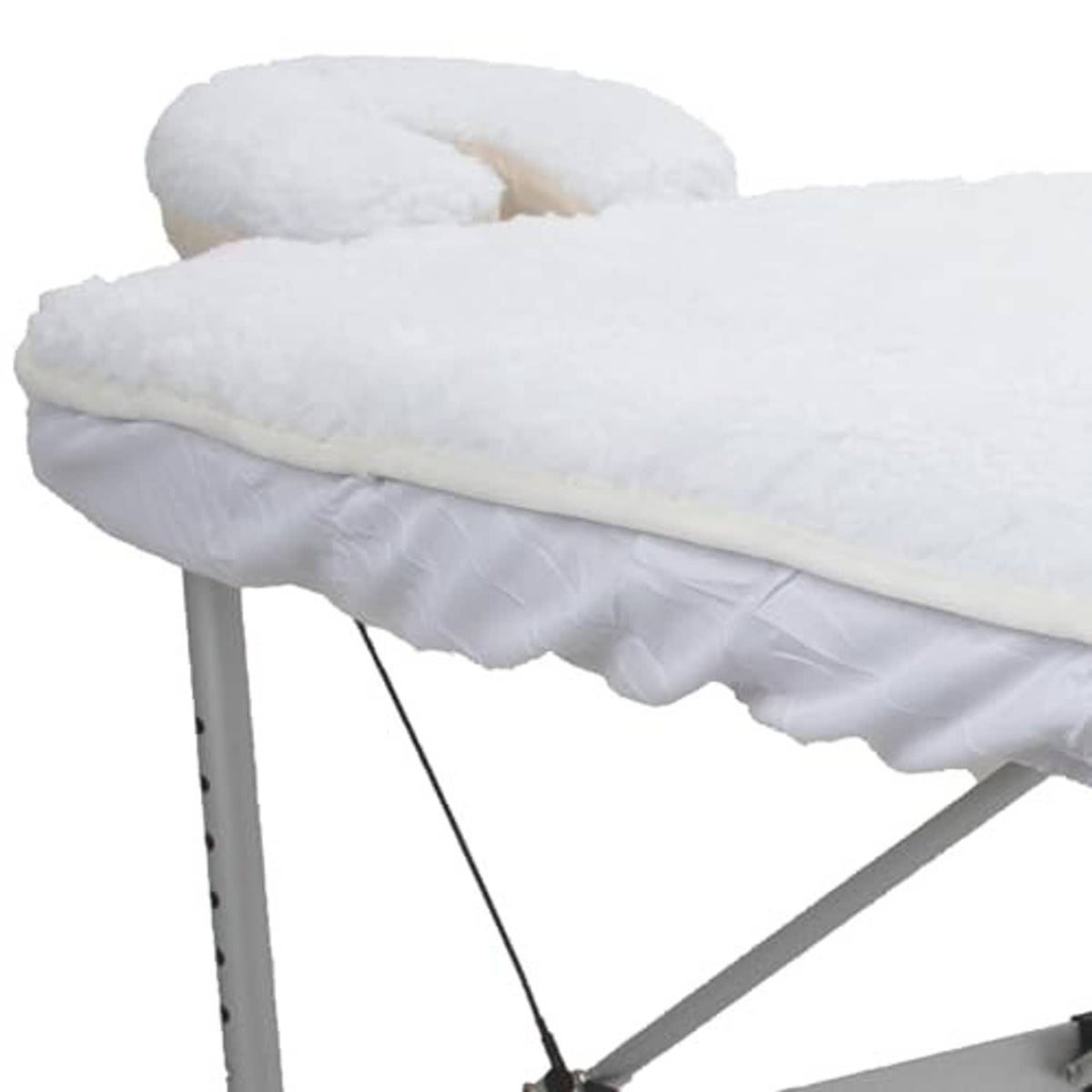 White fleece massage table pad set with plush top pad and cushioned fold