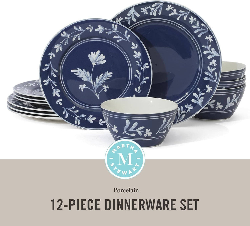 Dark blue porcelain dinnerware set with white floral border plates and matching bowls