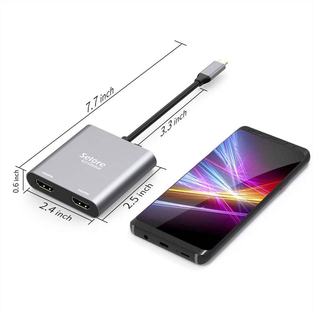 Compact grey dual HDMI USB-C adapter with dimensions and connected phone