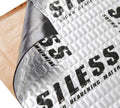Rolled corner of car sound deadening mat with silver foil and textured surface