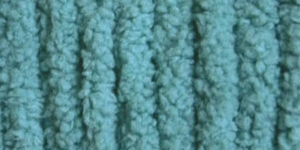 Close-up of light teal textured yarn with looped, tufted surface