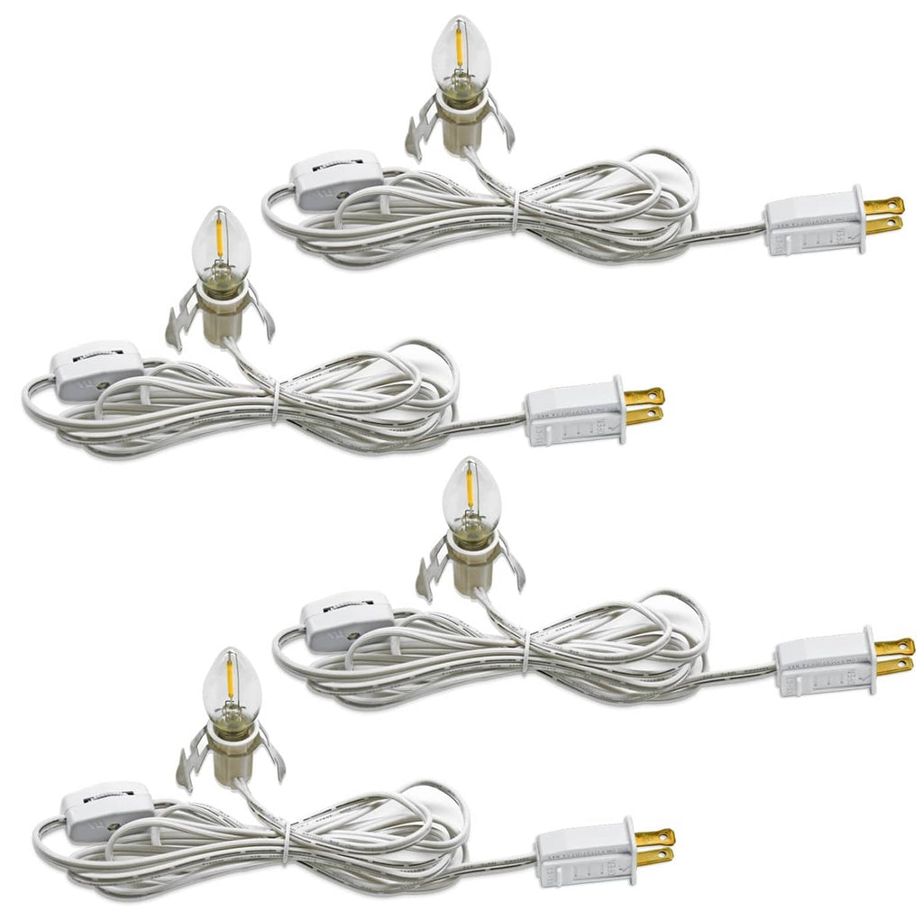Pack of four white LED night light cords with clear glass candle-style bulbs and plugs