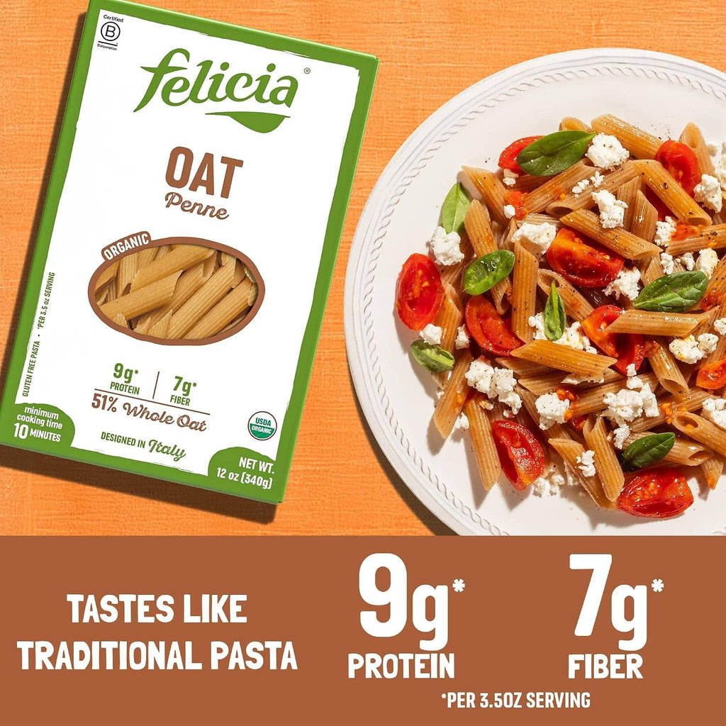 Felicia Oat Penne gluten-free organic pasta box beside plate of cooked penne