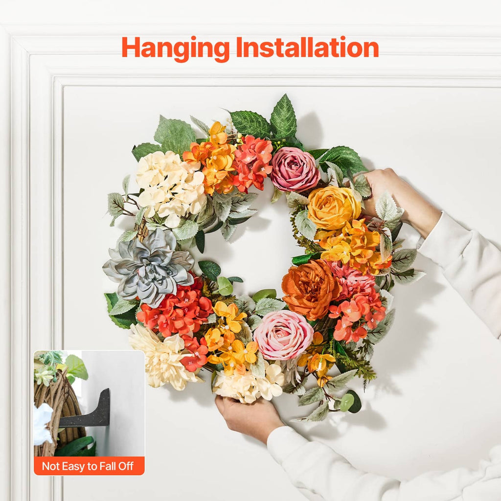 Hanging floral wreath with Welcome sign, orange and red roses, and cream hydrangea blooms