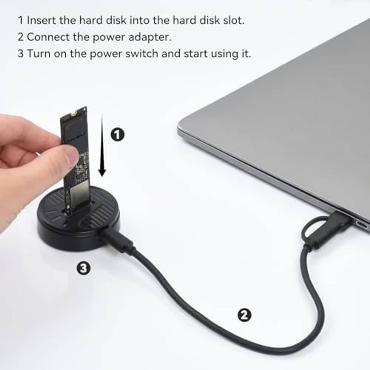 Hand placing an M.2 NVMe card into the round adapter dock with cable