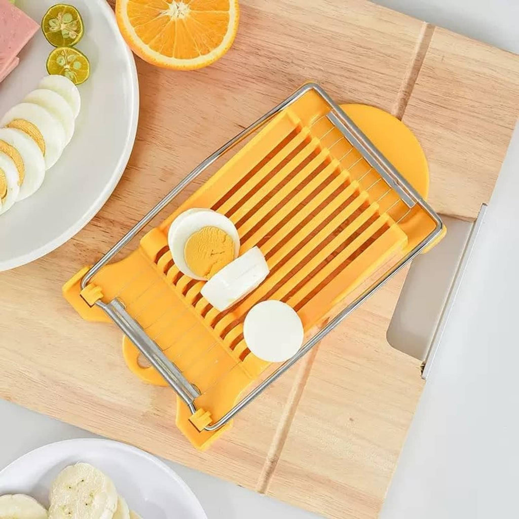 Yellow slicer cutting multiple white round slices with a metal wire frame