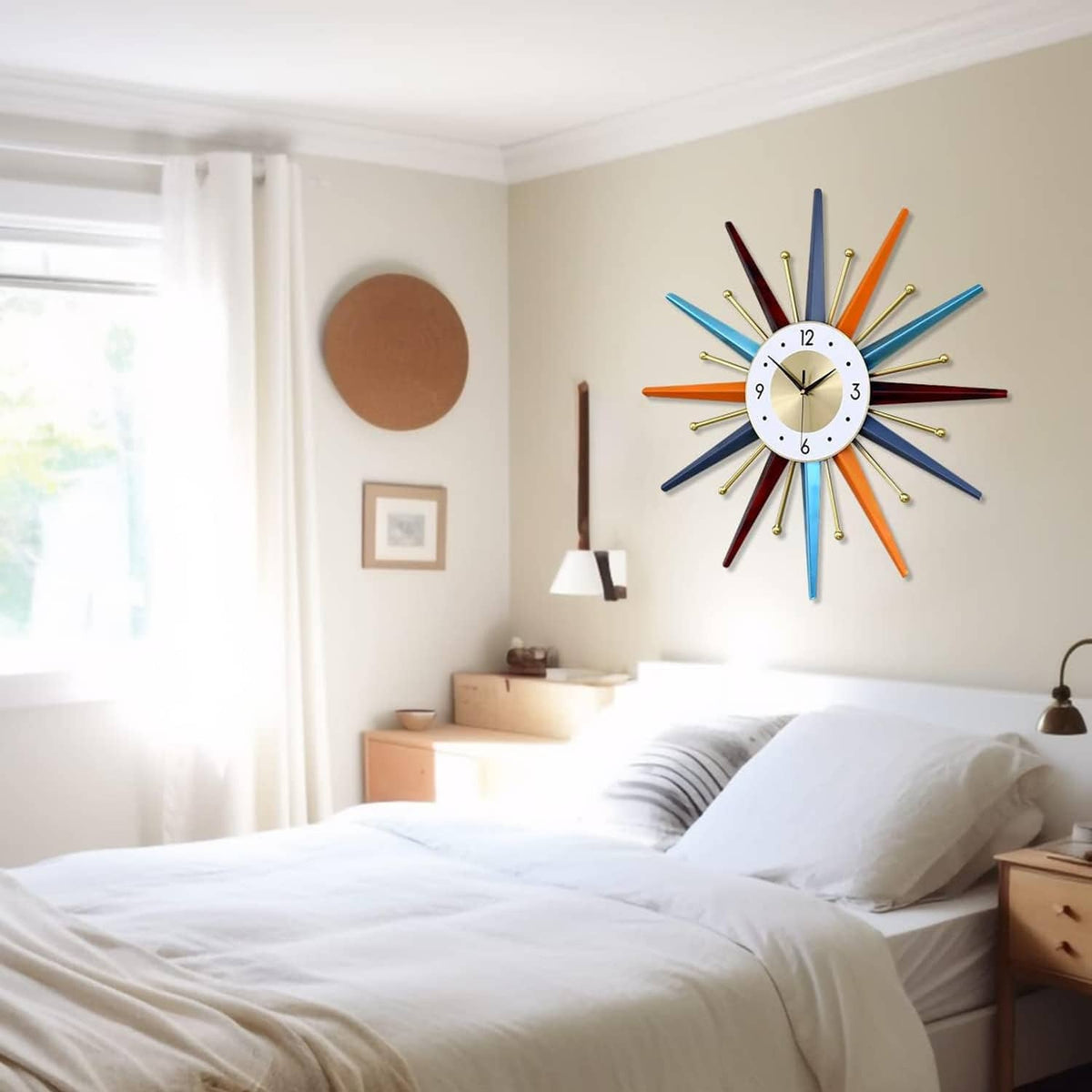 Starburst wall clock with multicolor rays and white dial mounted above a bed.
