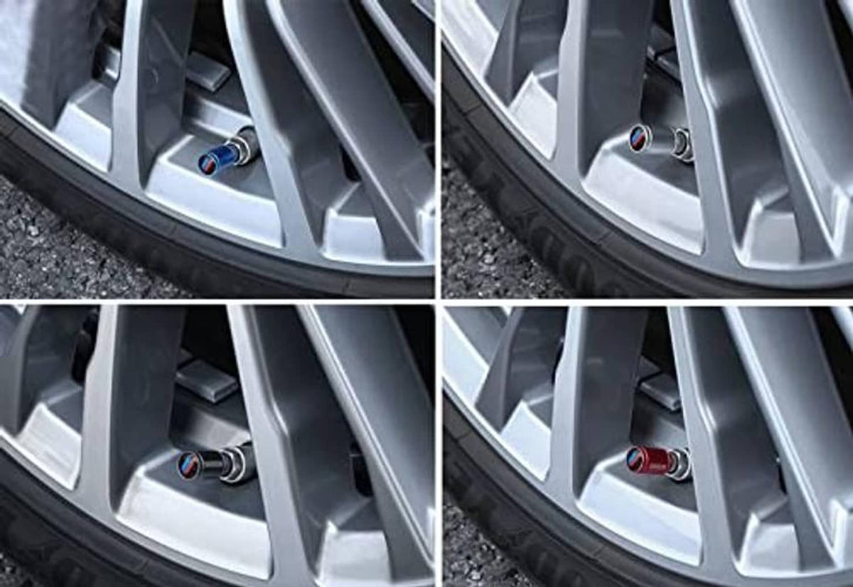 Red valve stem caps installed on silver alloy wheel spokes