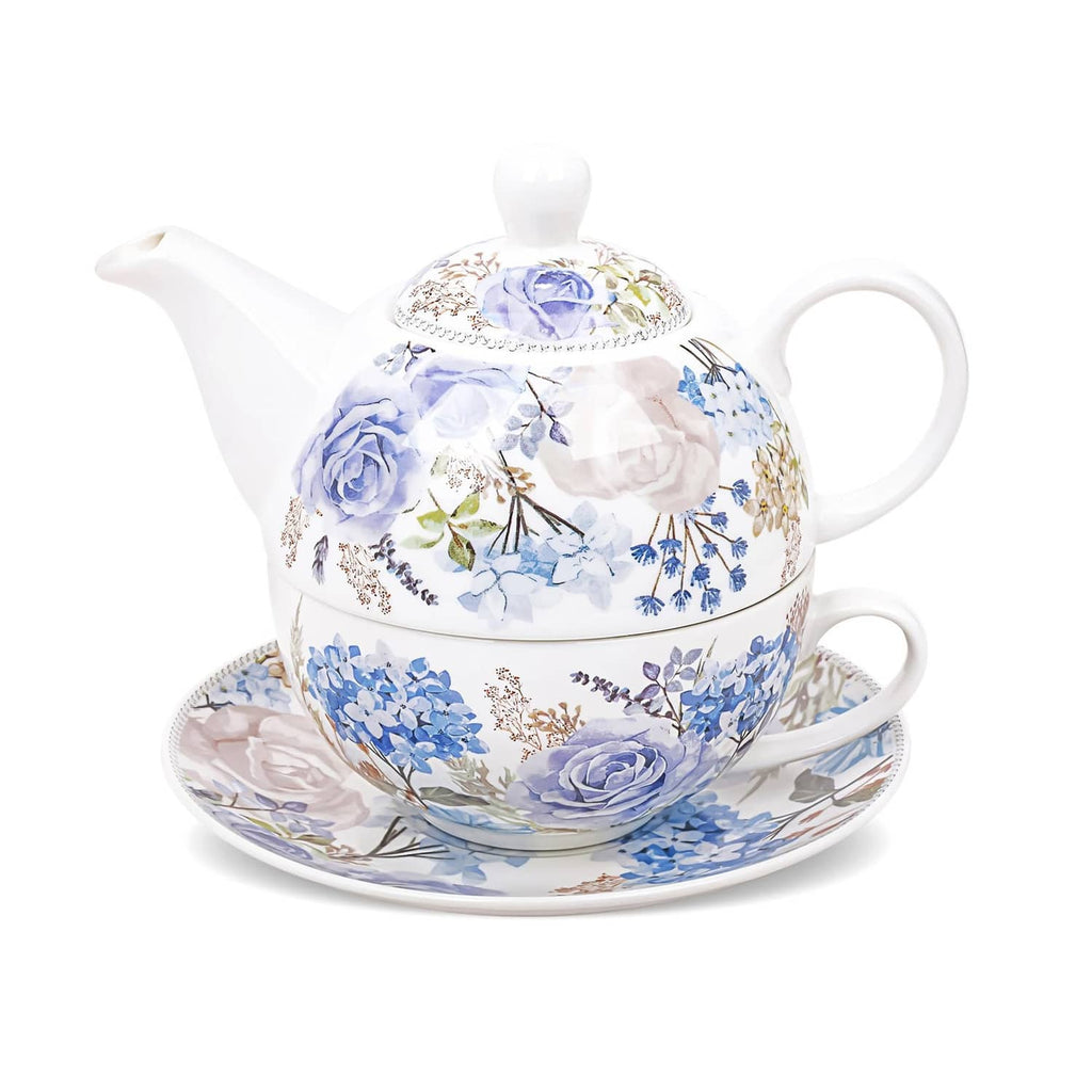 Porcelain tea for one set with blue and purple floral teapot, cup, and saucer.