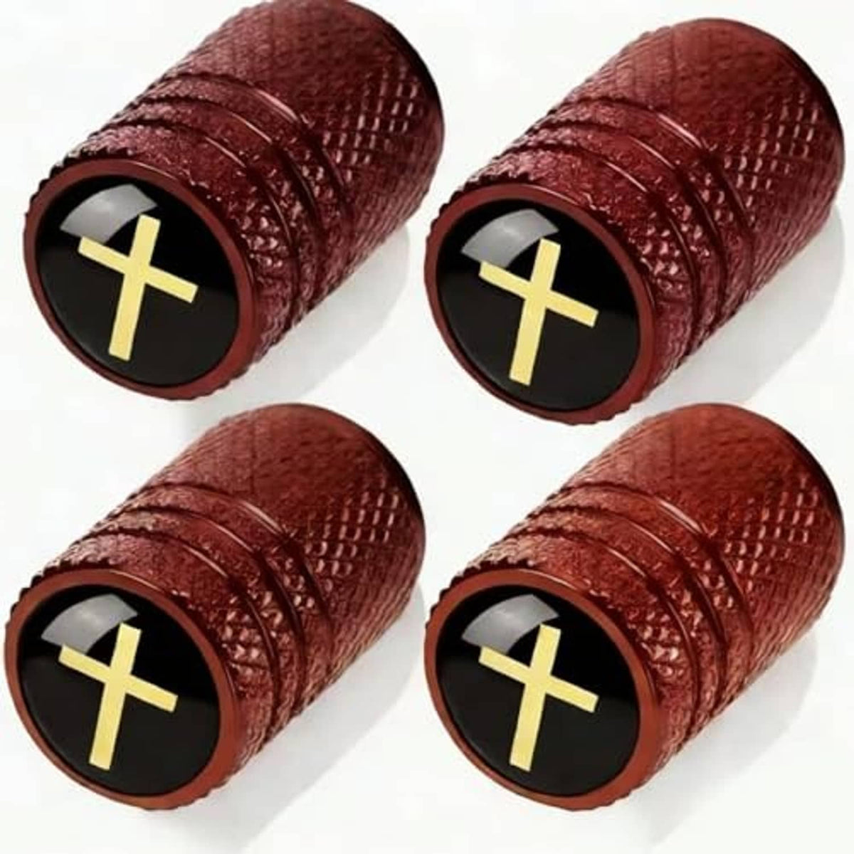 Car tire valve stem caps, close-up view of four burgundy textured caps with gold cross