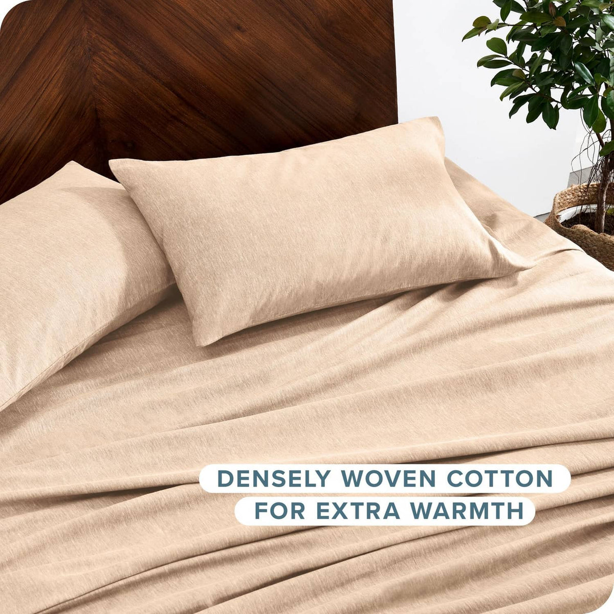 Heathered oatmeal flannel pillowcase and sheet on bed with neatly folded bedding