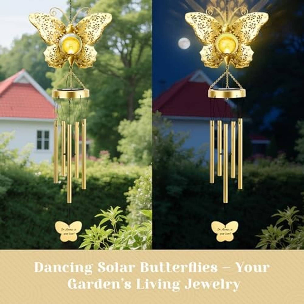 Gold butterfly solar wind chime with glowing bulb, filigree wings, and hanging tube chimes