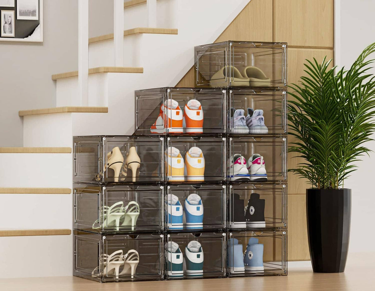 Transparent stackable shoe organizer boxes with hinged clear doors and shoes arranged inside