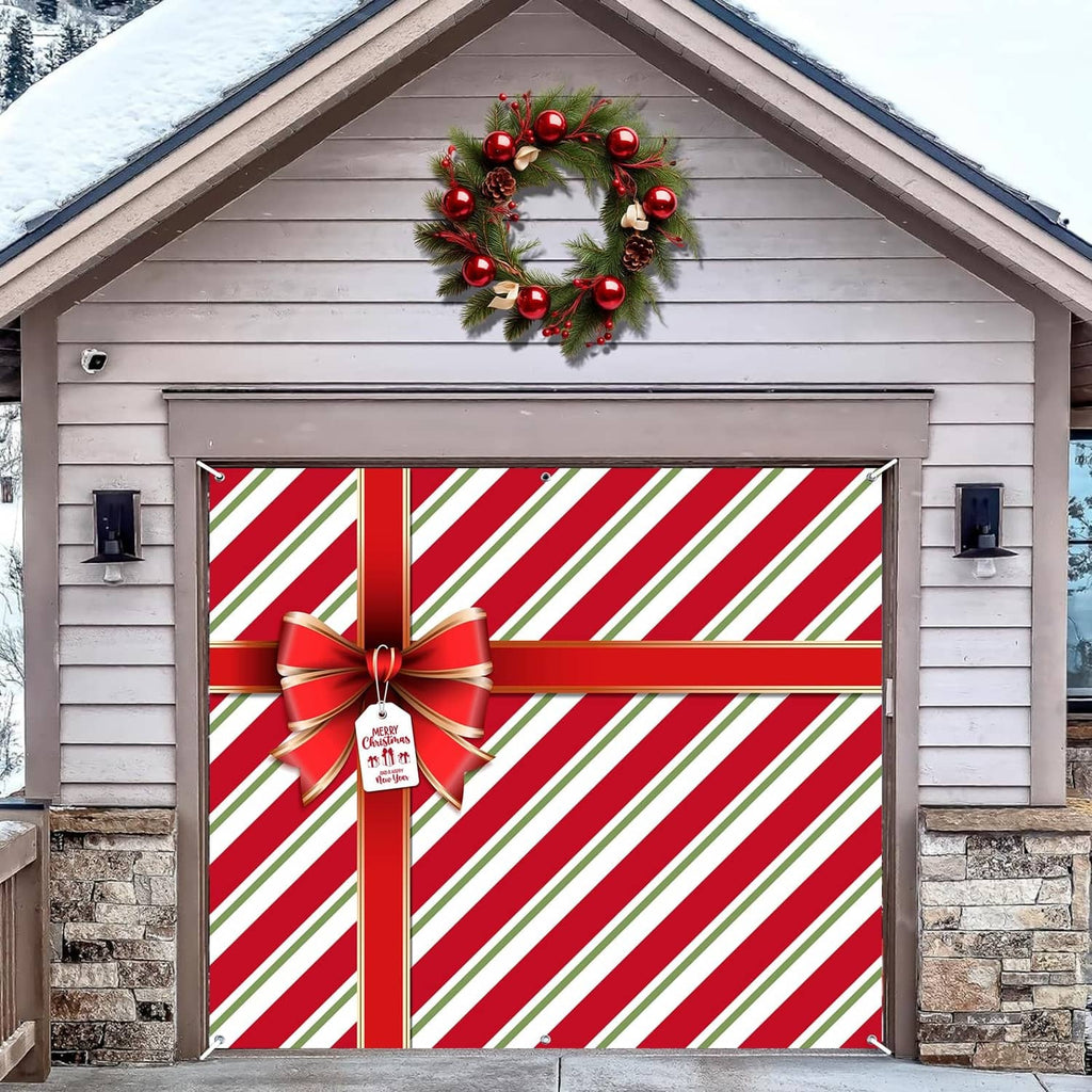 Red and green striped garage door cover with large bow and hanging tag
