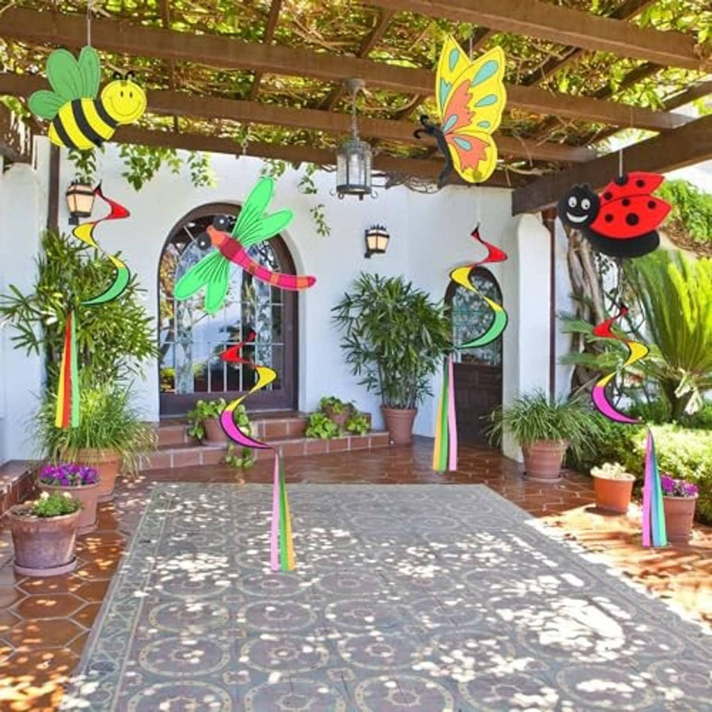 Garden wind spinners set with ladybug, butterfly, dragonfly, and bee figures suspended outdoors